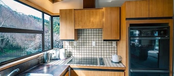 Port Watch – Relaxed Kiwi Bach Over Akaroa Harbour