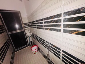 Shower, free toiletries, slippers, towels