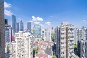 A high-rise urban area with modern buildings and a clear sky. - Tyms Elegant 4BR 2BA Apt Xujiahui Malls (Shanghai)