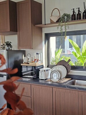 Villa familiar, vista al jardín | Área de sala de estar