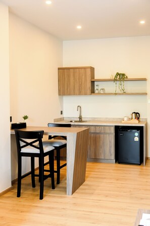 Standard Studio Suite, 1 King Bed, Hill View | Living area | 55-inch Smart TV with cable channels - Wora Hotel (Ratsada)
