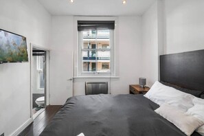 1 غرفة نوم ومكواة/لوح كي وواي فاي وملاءات أسرّة