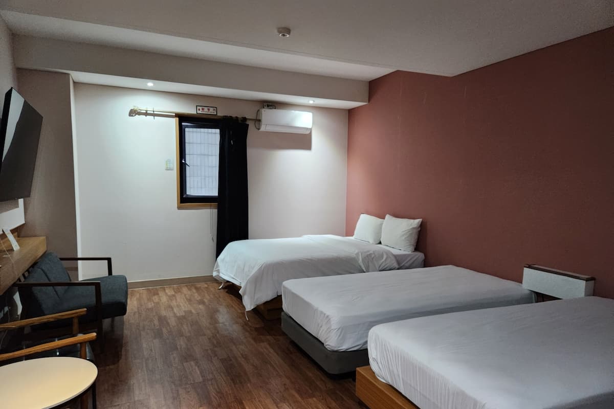 Family Triple Room | Desk, laptop workspace, blackout drapes, free WiFi