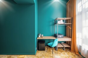 Triple Room, City View | In-room safe, desk, laptop workspace, blackout drapes
