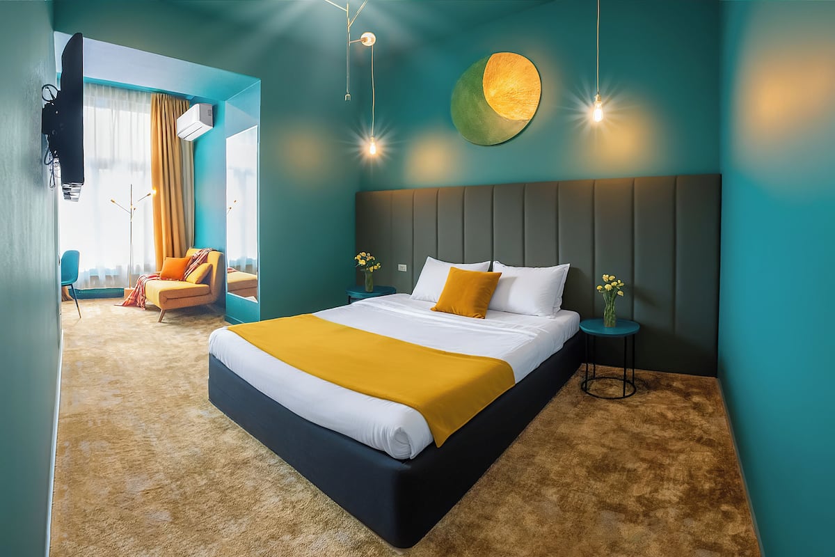 Triple Room, City View | In-room safe, desk, laptop workspace, blackout drapes