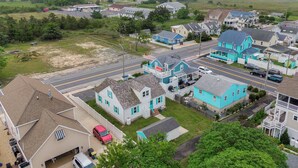 A residential area with houses, a road, and a water tower in the distance. - 212 E. Savannah Road. Lewes, Delaware (Lewes)