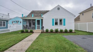 A single-story house with a porch, a small front yard, and a white picket fence. - 212 E. Savannah Road. Lewes, Delaware (Lewes)