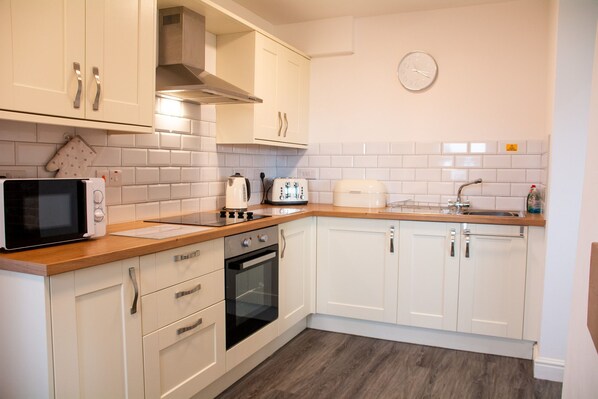 Fridge, microwave, toaster, dining tables