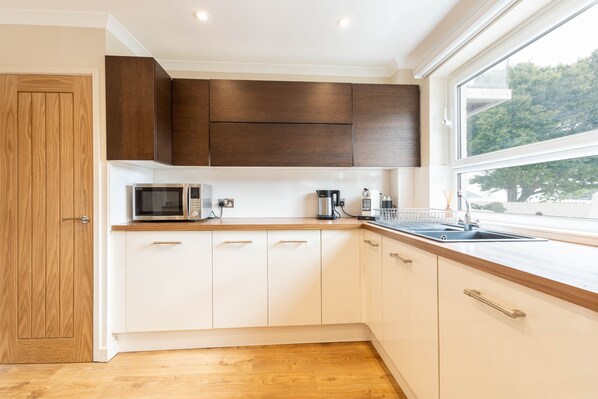 Fridge, microwave, dining tables