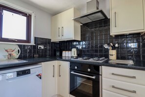 Cottage | Private kitchen | Dishwasher, cookware/dishes/utensils - The Loft (Truro)