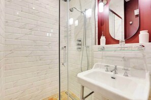 Shower, hair dryer, towels, shampoo