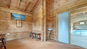 A wooden cabin interior with a pool, a bench, and a sink. - 2 bedroom accommodation in Blandford Forum (Blandford Forum)