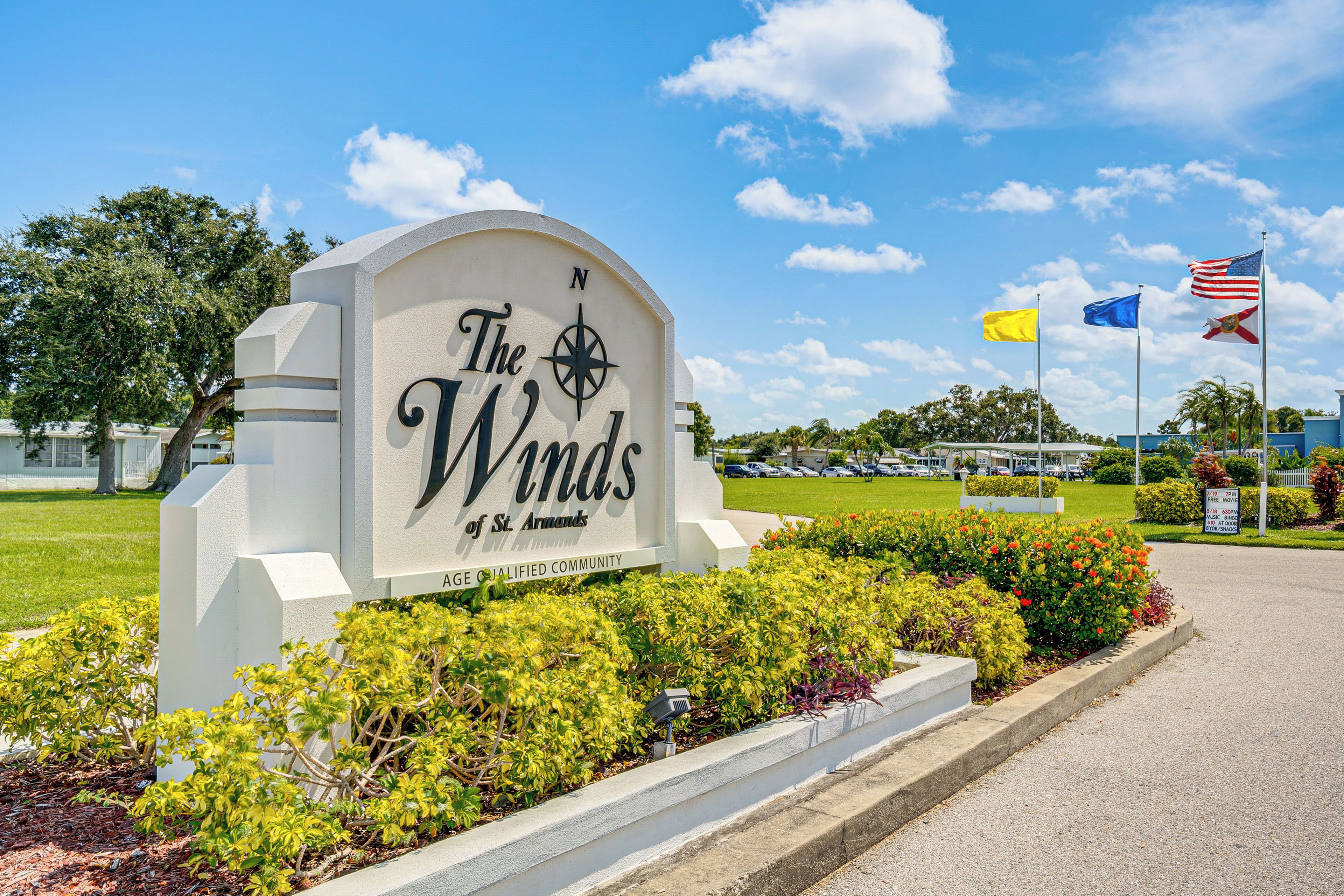 A sign for The Winds of St. Andrews, indicating a community with a compass symbol.