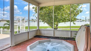 A hot tub area with a view of a tree and a white fence. - Private Hot Tub! Home < 1 Mi to Lake Okeechobee (Okeechobee)