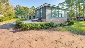 A single-story house with a brick foundation and a grey siding exterior. - Close to Hospital & Dtwn! Quiet Waycross Home (Waycross)