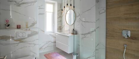 Shower, hair dryer, towels, soap