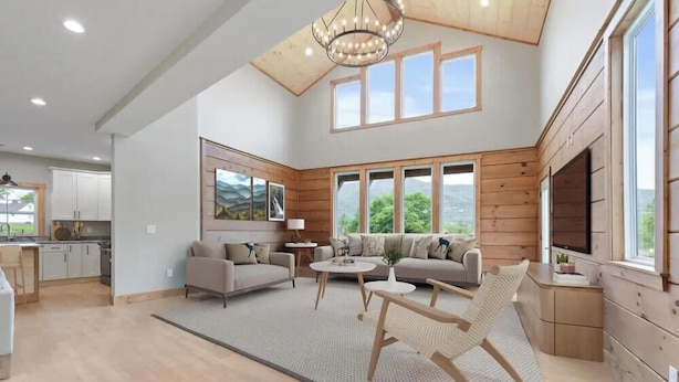 A spacious living room with a high ceiling, large windows, and a cozy seating area. - Mountain View Splash - Indoor Pool Hot Tub Game Room Stunning Smoky Mountain Views (Sevierville)
