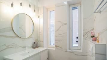 Shower, hair dryer, towels, soap