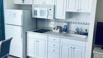 Fridge, microwave, stovetop, coffee/tea maker