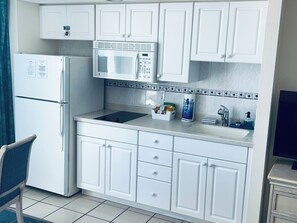 Fridge, microwave, stovetop, coffee/tea maker