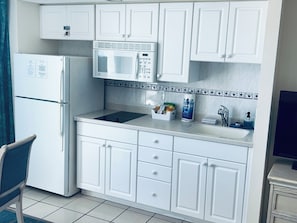 Fridge, microwave, stovetop, coffee/tea maker