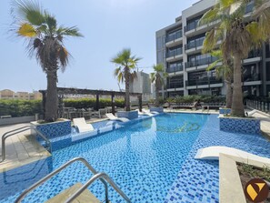 Outdoor pool - Vogue | Chaimaa Avenue JVC near Circle Mall (Dubai)