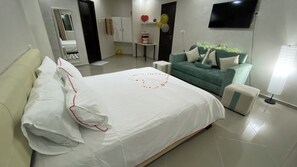 Comfort Suite, Balcony, Pool View | Desk, laptop workspace, iron/ironing board, free WiFi