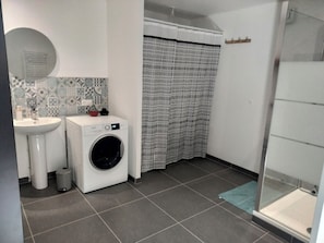 Shower, hair dryer, towels, toilet paper