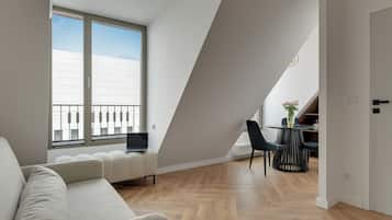 Deluxe Studio, River View | Living area | Flat-screen TV