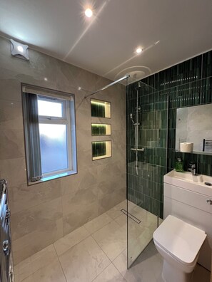 Shower, hair dryer, towels, soap
