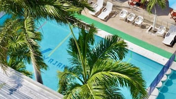 Outdoor pool, open 9:00 AM to 9:00 PM, pool umbrellas