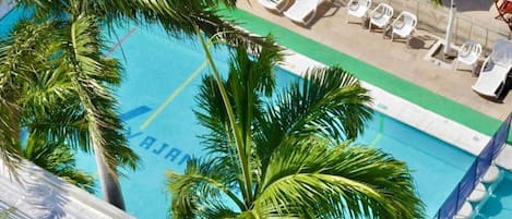 Outdoor pool, open 9:00 AM to 9:00 PM, pool umbrellas