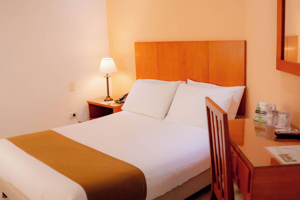 Desk, laptop workspace, free WiFi, bed sheets