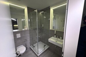 Shower, hair dryer, towels, toilet paper
