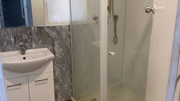 Bidet, towels, soap, toilet paper