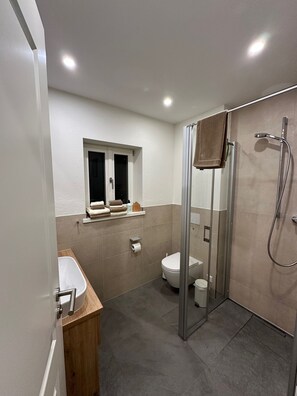 Shower, hair dryer, towels, soap