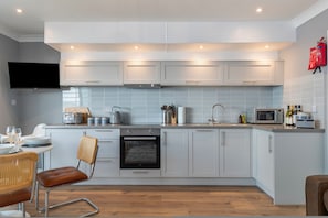 Fridge, microwave, oven, stovetop - 33 Beach Court - Direct Beach Access, Sea Views (Saundersfoot)