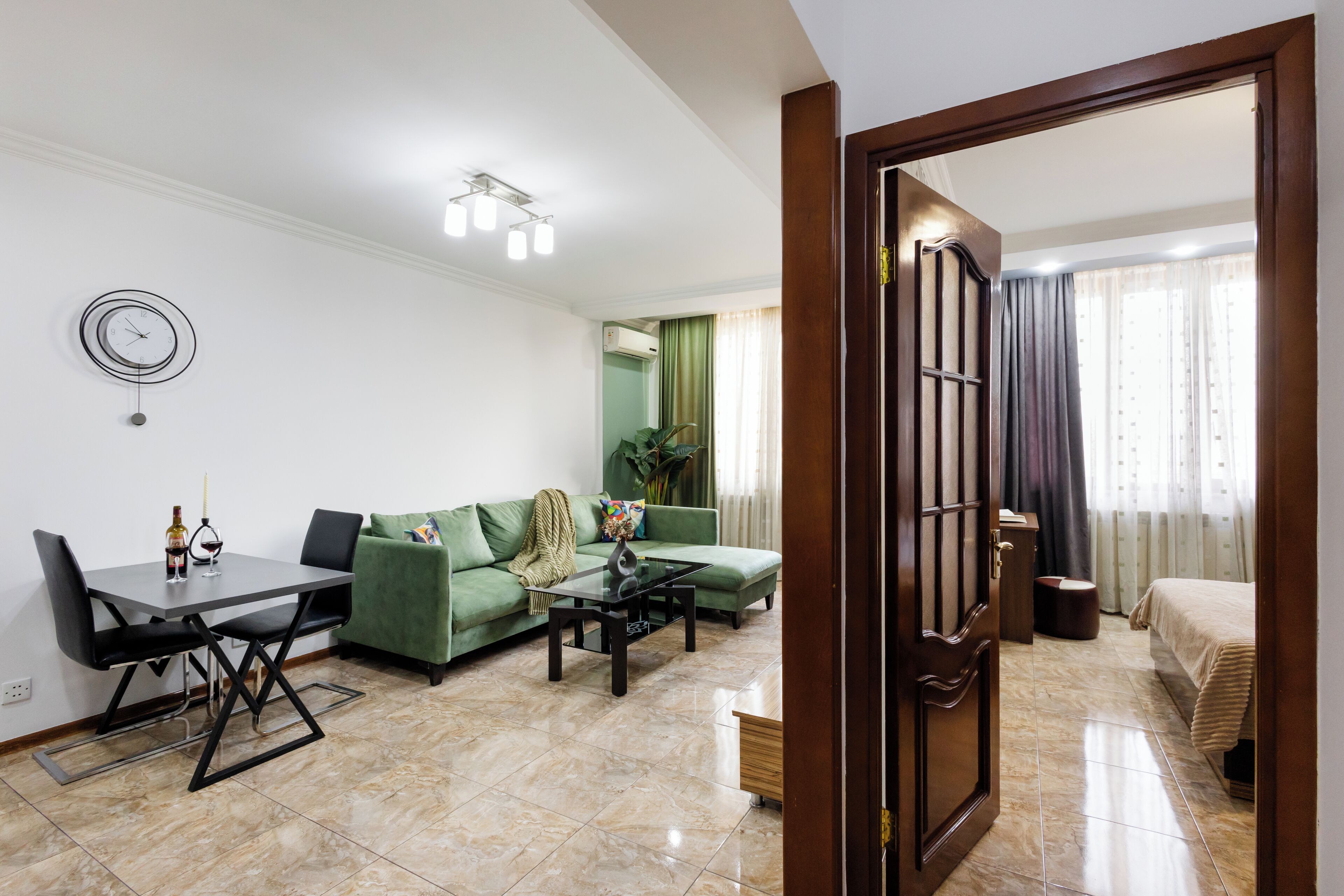 Standard Apartment, City View | Living area | 50-inch flat-screen TV with cable channels