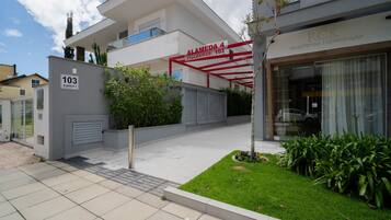 A modern building with a sign reading "Alameda 4 residence 103".