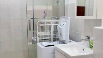 Shower, hair dryer, towels