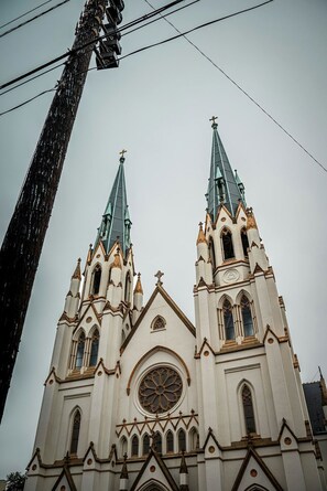 A church with two spires and a large rose window.