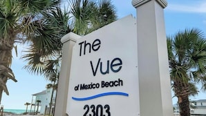 A sign for "The Vue of Mexico Beach" with the address 2303. - Gulf Front 3 Bedroom Condo in Mexico Beach at The Vue (Mexico Beach)