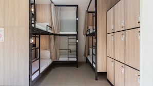 A dormitory room with bunk beds, wooden lockers, and a tiled floor. - Hostel Leblon - 12-bed mixed shared room (Rio de Janeiro)