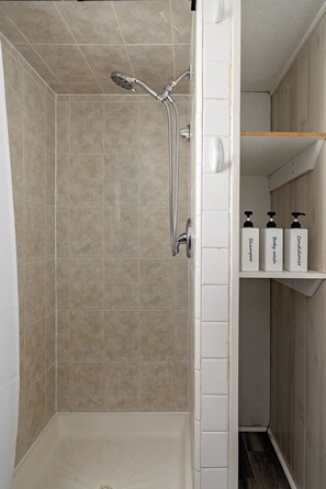 Shower, hair dryer, towels, soap