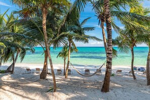 On the beach, sun loungers, beach towels