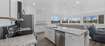 Brand-new 4-bed, 2-bath suite with stunning lake views.