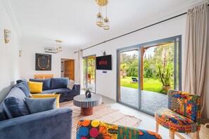 Superior suite, uitzicht op tuin | Woonruimte