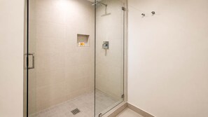 Shower, hair dryer, towels, shampoo