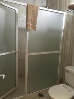 Shower, towels, soap, toilet paper