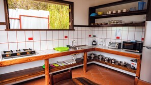 Microwave, toaster, cookware/dishes/utensils, dining tables